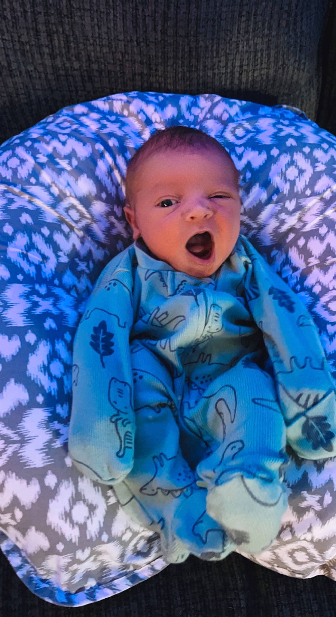 Gannon is registered to the contest to win money with this photo: azure, baby, baby_products, baby_toddler_clothing, cheek, comfort, electric_blue, human_body, iris, linens, magenta, nose, outerwear, pattern, person, purple, skin, sleeve, textile, toddler