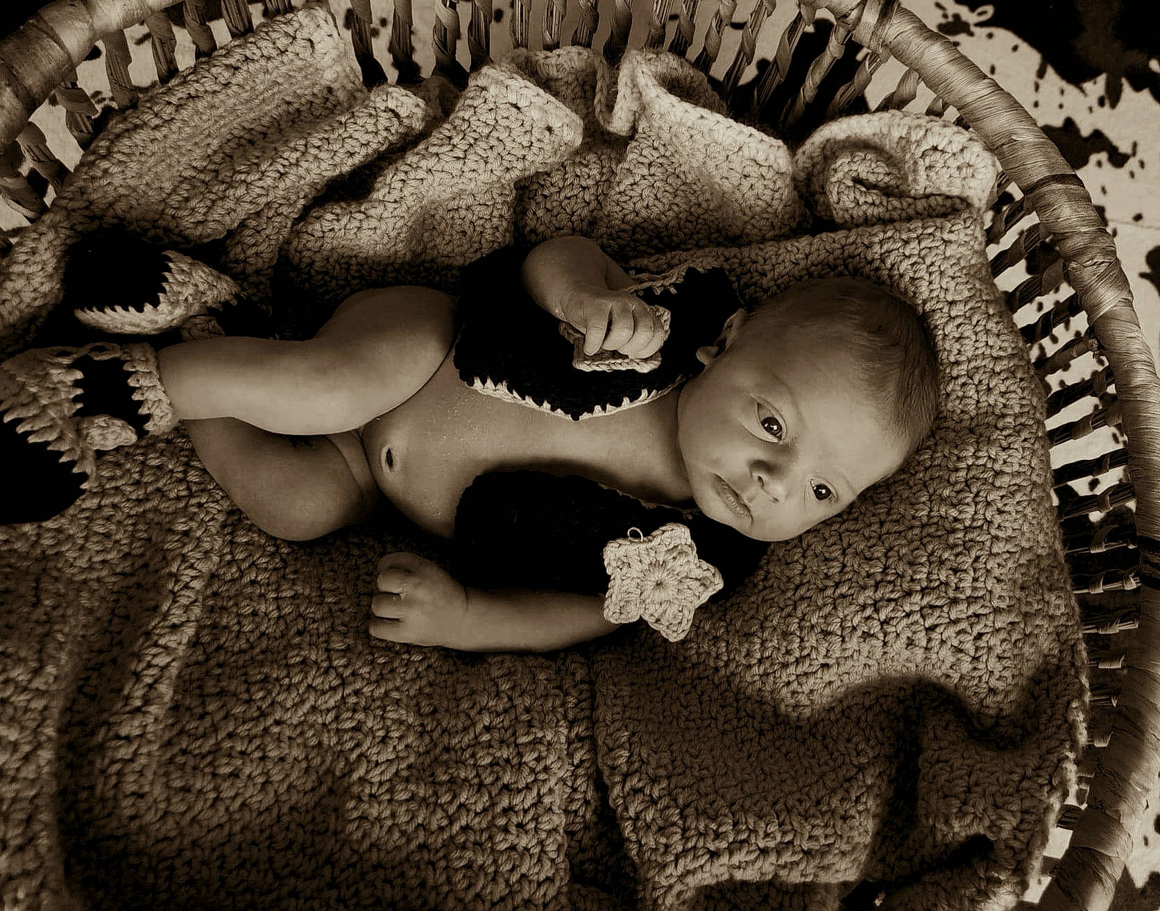 Gannon is registered to the contest to win money with this photo: arm, baby, black_and_white, child, comfort, eye, eyelash, face, flash_photography, happy, head, headgear, human_body, iris, mouth, organism, person, skin, style, toddler