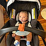 Lucien is registered to the contest to win money with this photo: adult, baby, chair, clothing, cushion, face, female, footwear, furniture, head, homedecor, hosiery, person, photography, portrait, shoe, sock, transportation, vehicle, woman