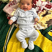 Lucien joined the competition — help win amazing prizes! baby, bed, blanket, clothing, cushion, dress, face, furniture, happy, head, homedecor, linen, newborn, pants, person, photography, portrait, quilt, sitting, smile