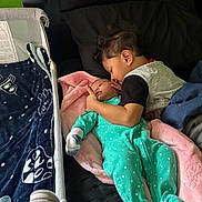 Ignacio joined the competition — help win amazing prizes! baby, child, bed, blanket, blue_blanket, bonding, caring, clothing, crib, family, footwear, head, infant, love, person, playpen, portrait, sibling, sleepwear, toddler