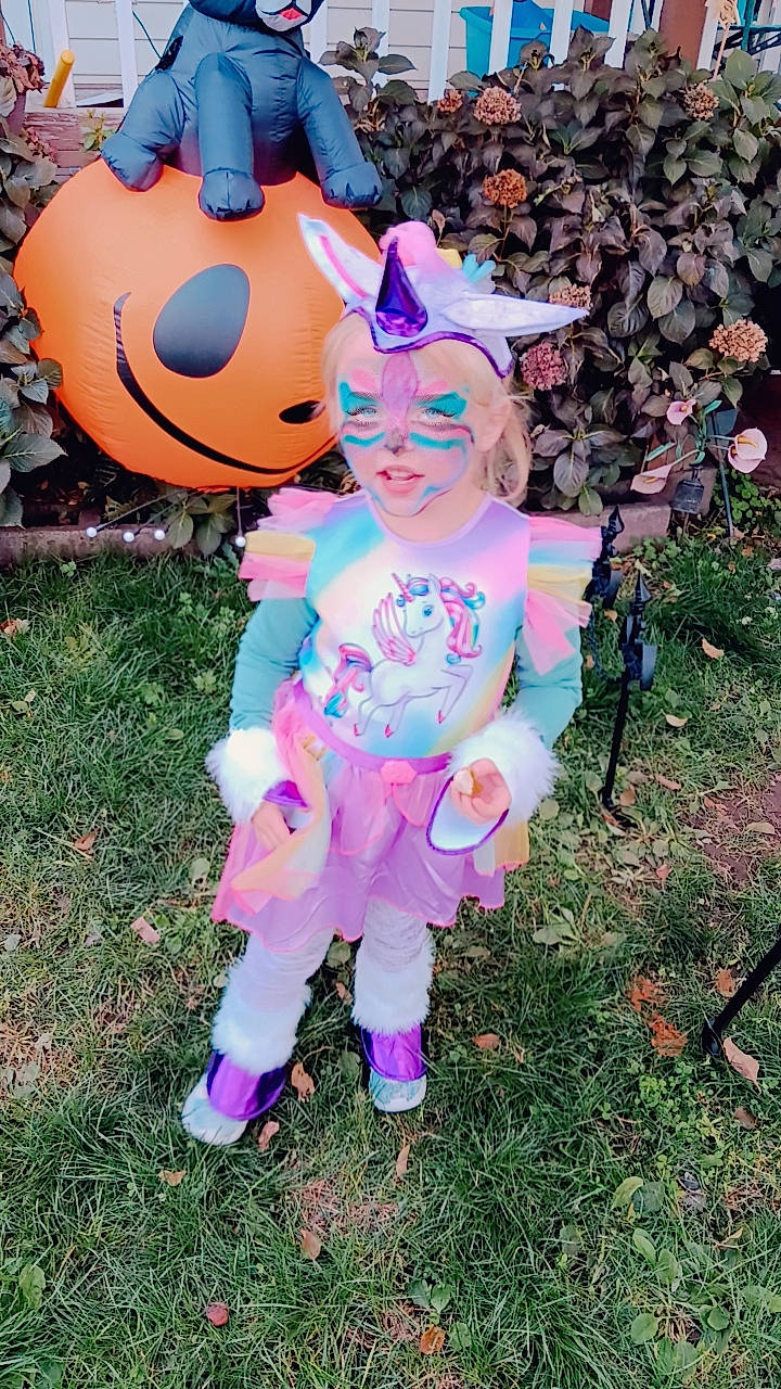 Bayleigh is registered to the contest to win money with this photo: art, automotive_wheel_system, child, costume, fictional_character, fun, garden, grass, happy, lawn_ornament, magenta, party_supply, person, pink, plant, plush, purple, recreation, smile, stuffed_toy