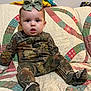 bed, boy, child, clothing, couch, crawling, cushion, face, furniture, head, homedecor, male, military, pants, person, photography, portrait, quilt, sitting, toy