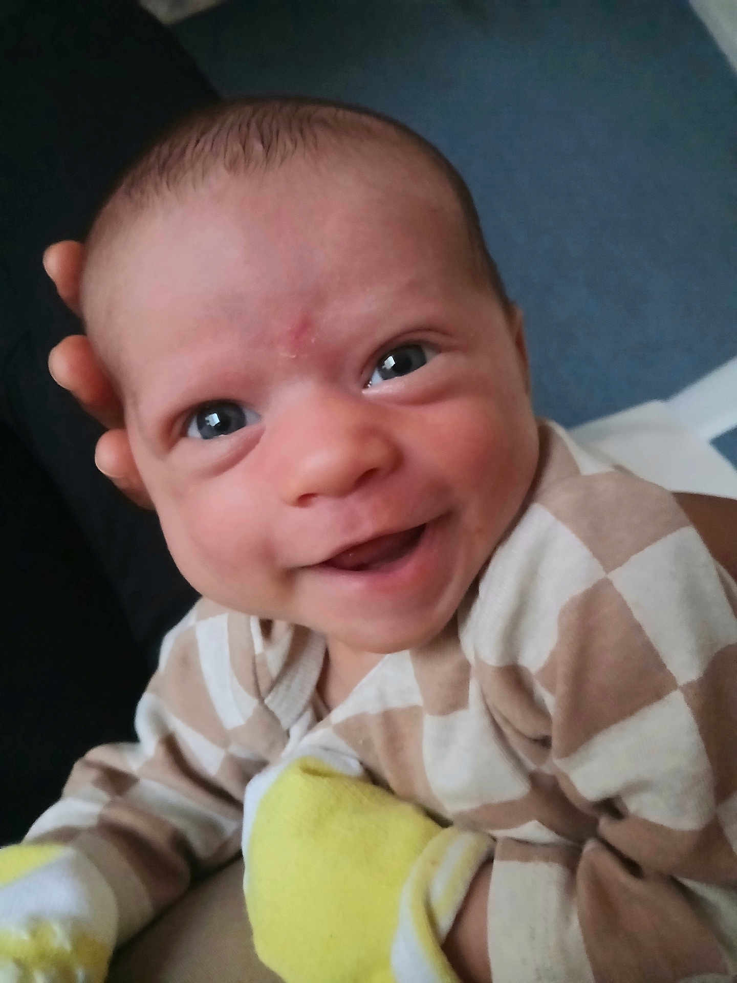 Sadaf joined the competition — help win amazing prizes! baby, smiling, face, eyes, hand, clothing, mittens, beige, white, yellow, infant, portrait, cute, happy, child, person, young, closeup, indoor, human