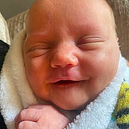Juniper joined the competition — help win amazing prizes! newborn, baby, smiling, face, hand, blanket, soft, peaceful, infant, cute, wrapped, skin, closeup, sleeping, child, young, indoors, cozy, portrait, warm