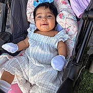 Emberlynn is registered to the contest to win money with this photo: baby, blanket, blue_bow, child, clothing, comfort, cute, fabric, happy, headwear, infant, mittens, outdoor, person, pillow, romper, seat, smiling, soft, stroller