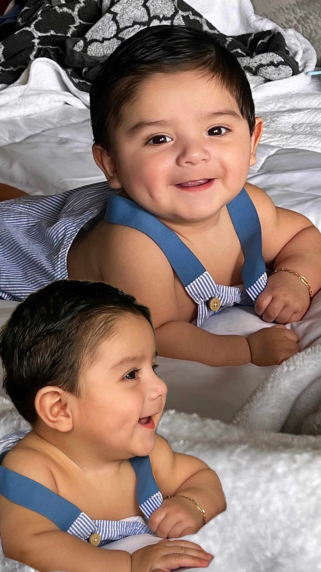 Noah joined the competition — help win amazing prizes! baby, smiling, infant, blue_suspender, bracelet, blanket, bed, cute, child, happy, portrait, indoors, soft_texture, skin, face, person, clothing, lying_down, baby_boy, close_up