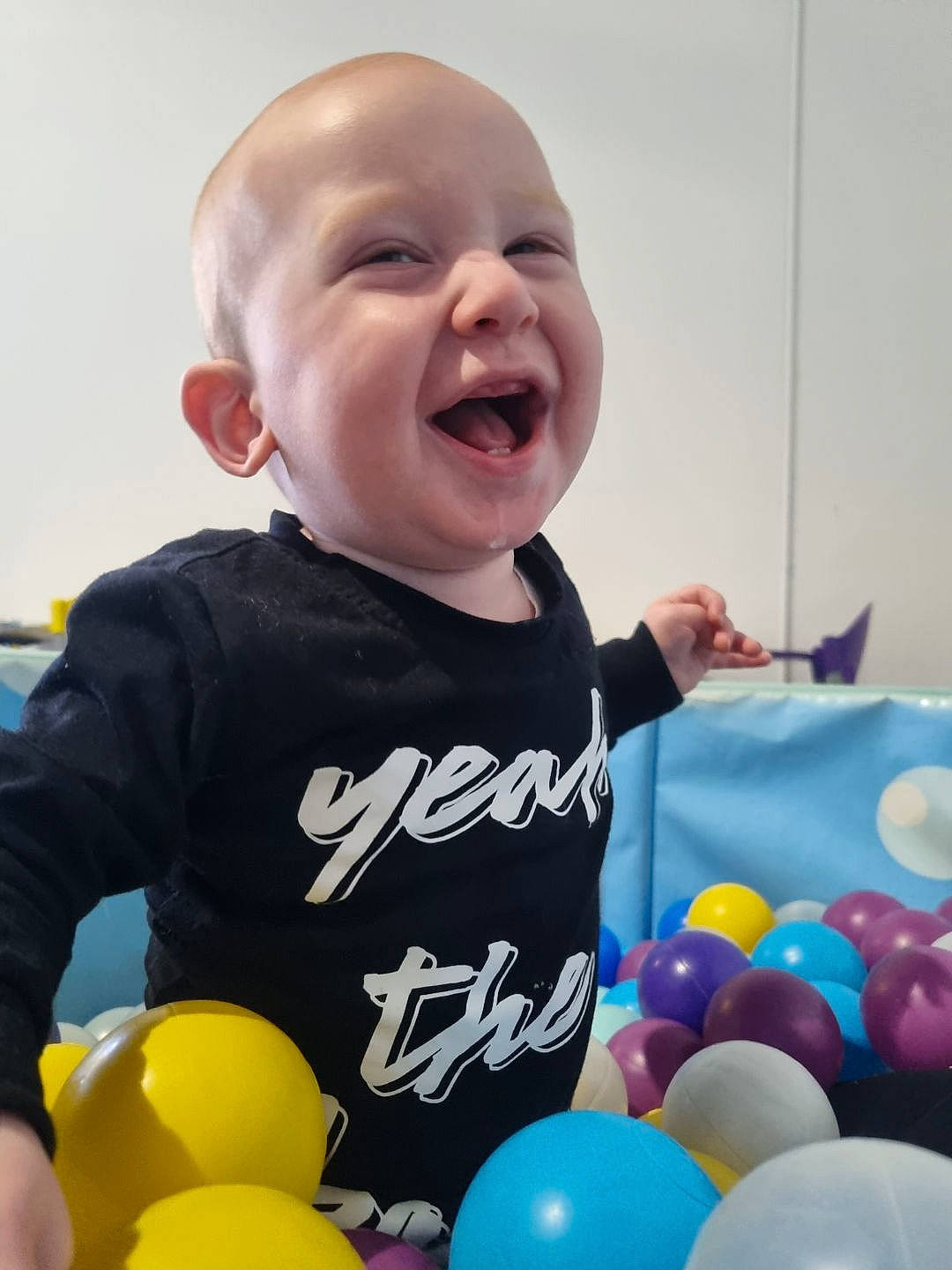 Jaxon joined the competition — help win amazing prizes! baby, baby_laughing, baby_playing_with_toys, baby_toddler_clothing, balloon, child, fun, happy, leisure, party_supply, person, photograph, product, sleeve, smile, snapshot, t_shirt, toddler, toy, white