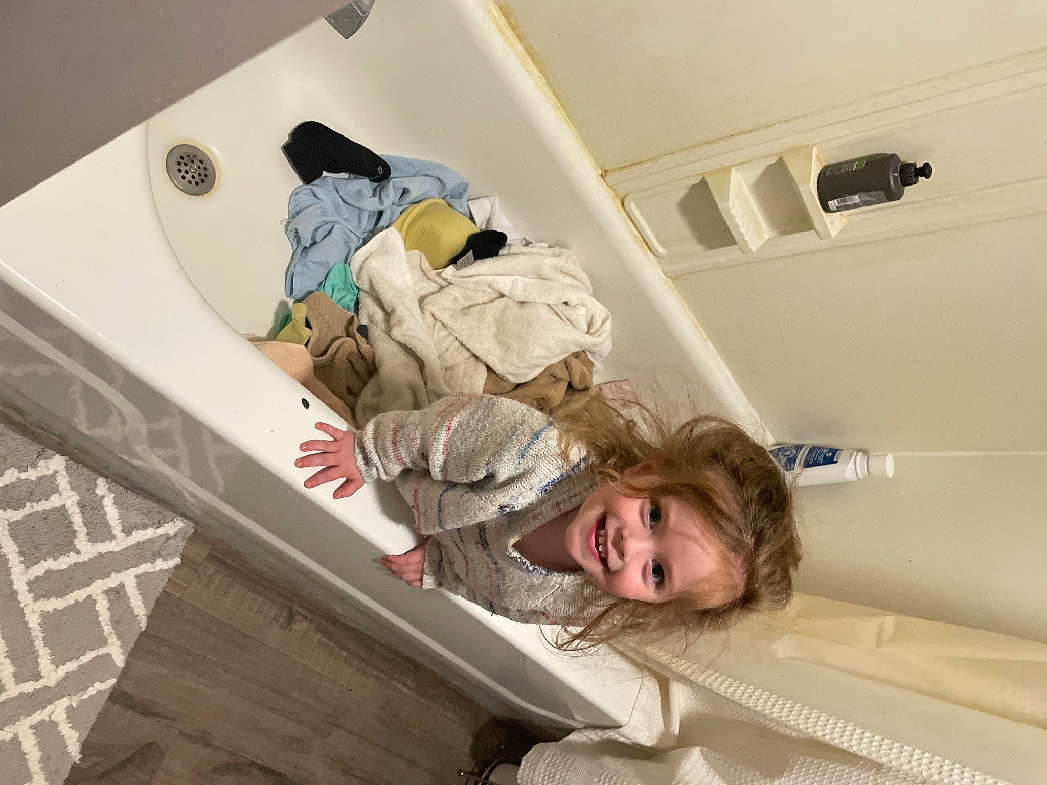 Camilla joined the competition — help win amazing prizes! automotive_exterior, baby_products, baby_safety, child, comfort, couch, flooring, joy, leisure, linens, luxury_vehicle, pattern, person, recreation, room, sitting, smile, table, toddler, wood