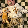 Bode joined the competition — help win amazing prizes! baby, blanket, child, clothing, comfort, cute, expression, indoor, infant, lying_down, pacifier, patterned_pants, plush_toy, portrait, real_person, soft_toy, stuffed_animal, tiger, tigger, white_socks