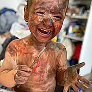 Ron a rejoint le concours — aidez-le/la à gagner de superbes lots ! child, paint, messy, smiling, face_paint, art, paintbrush, hands, colorful, happy, indoor, table, palette, expression, creative, fun, toddler, painting, joy, playful