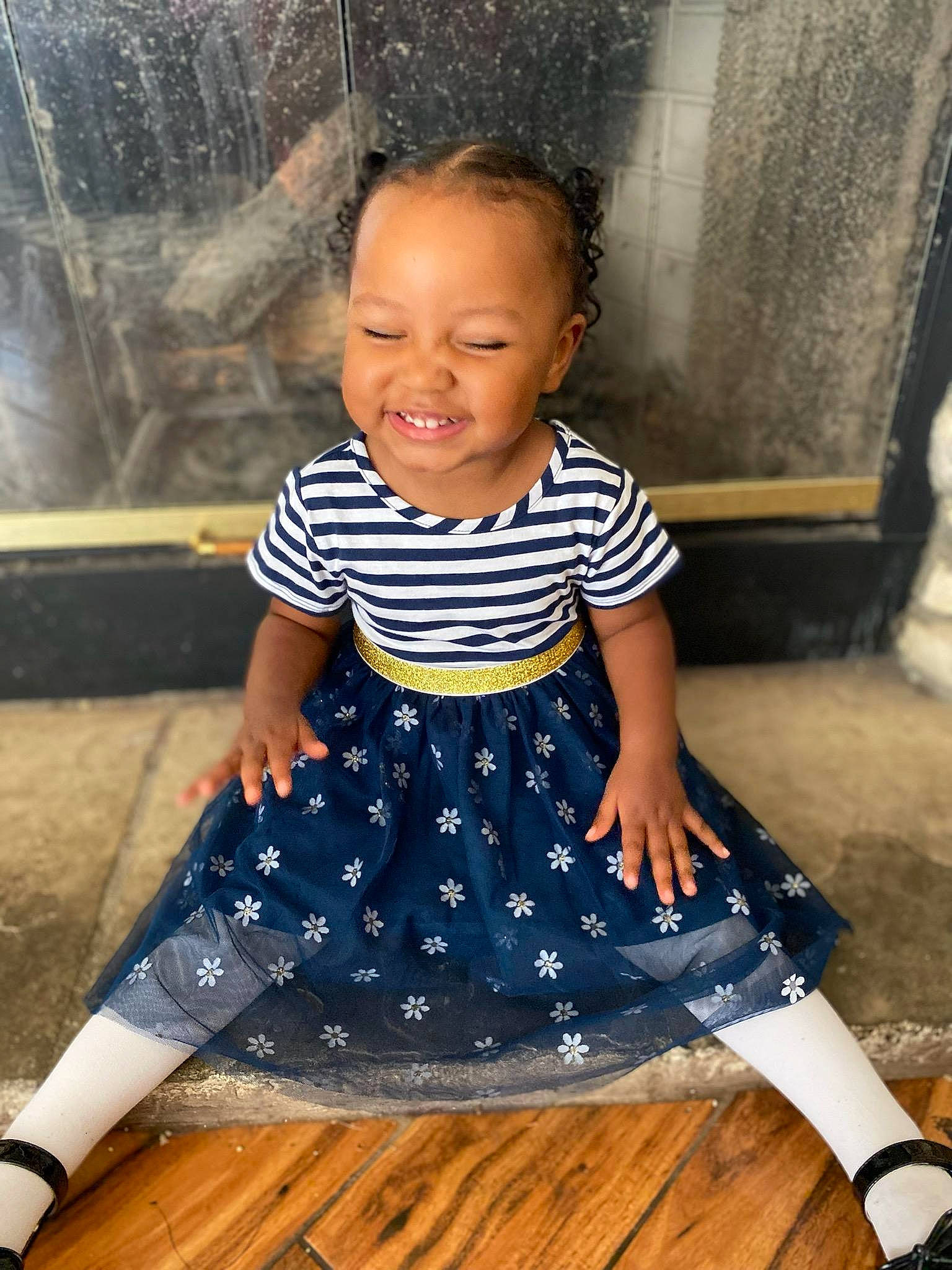 Aleena is registered to the contest to win money with this photo: baby_toddler_clothing, child, day_dress, electric_blue, flooring, hairstyle, happy, human_leg, joy, neck, one_piece_garment, pattern, person, photograph, purple, shoulder, sleeve, smile, t_shirt, toddler