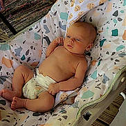 August joined the competition — help win amazing prizes! baby, infant, diaper, baby_rocker, patterned_fabric, indoor, wooden_floor, blanket, relaxed, cute, child, person, seated, comfort, soft_toys, home, resting, baby_girl, baby_boy, newborn