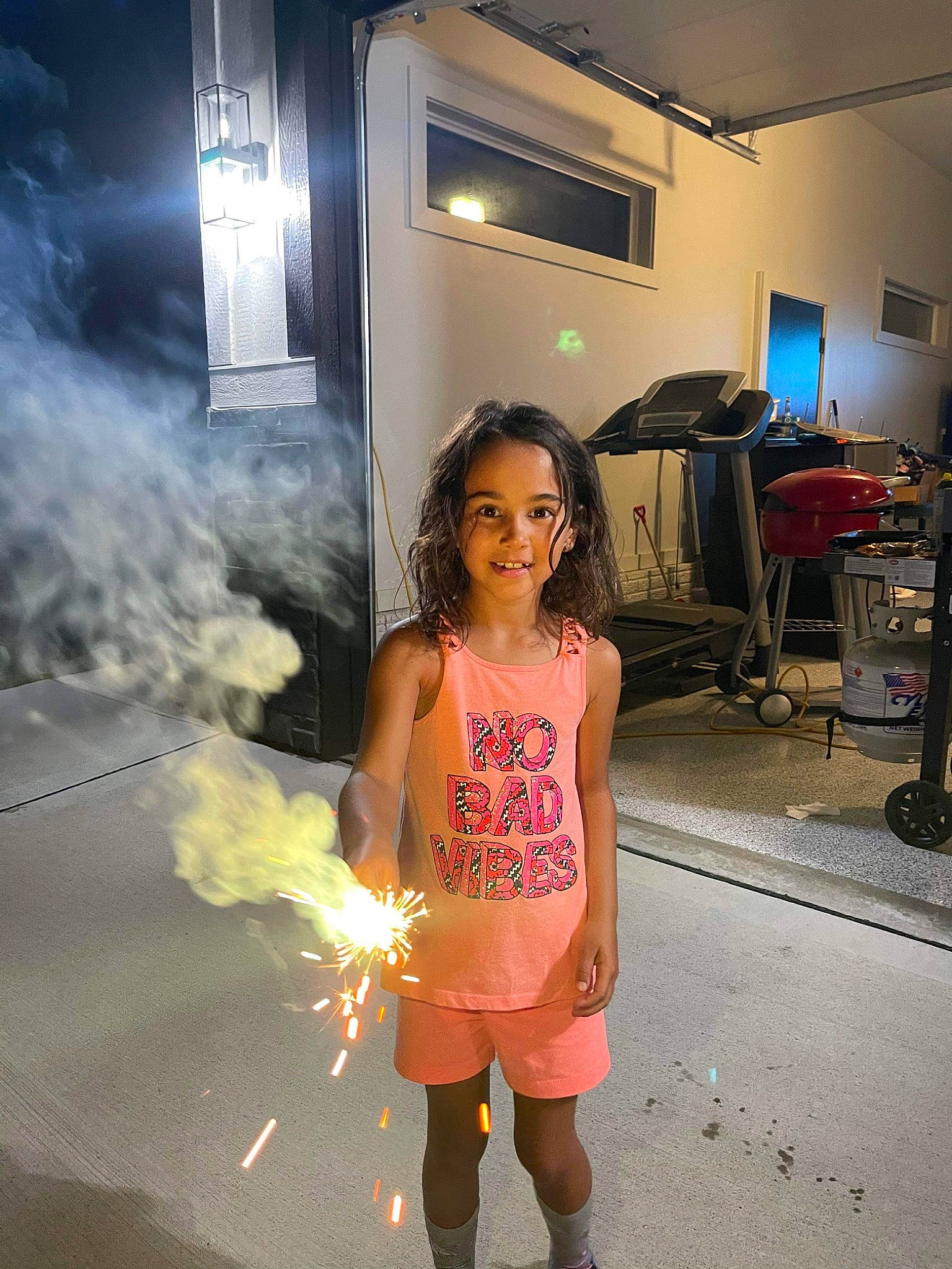 Alina is registered to the contest to win money with this photo: chair, child, electric_blue, event, fashion, fashion_design, fire, flooring, fun, happy, heat, human_leg, joy, leisure, lighting, person, sandal, smoke, t_shirt, television