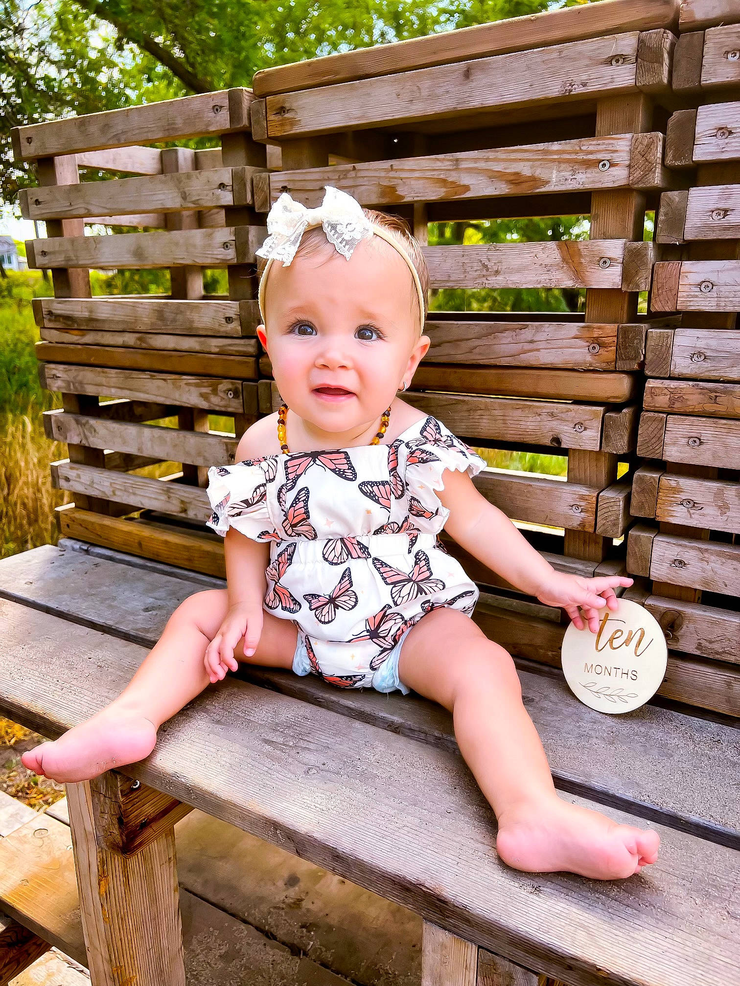 Amia joined the competition — help win amazing prizes! baby, baby_toddler_clothing, child, fence, fun, grass, happy, leisure, outdoor_furniture, pattern, person, plant, portrait_photography, shorts, sitting, sleeve, smile, toddler, tree, vacation