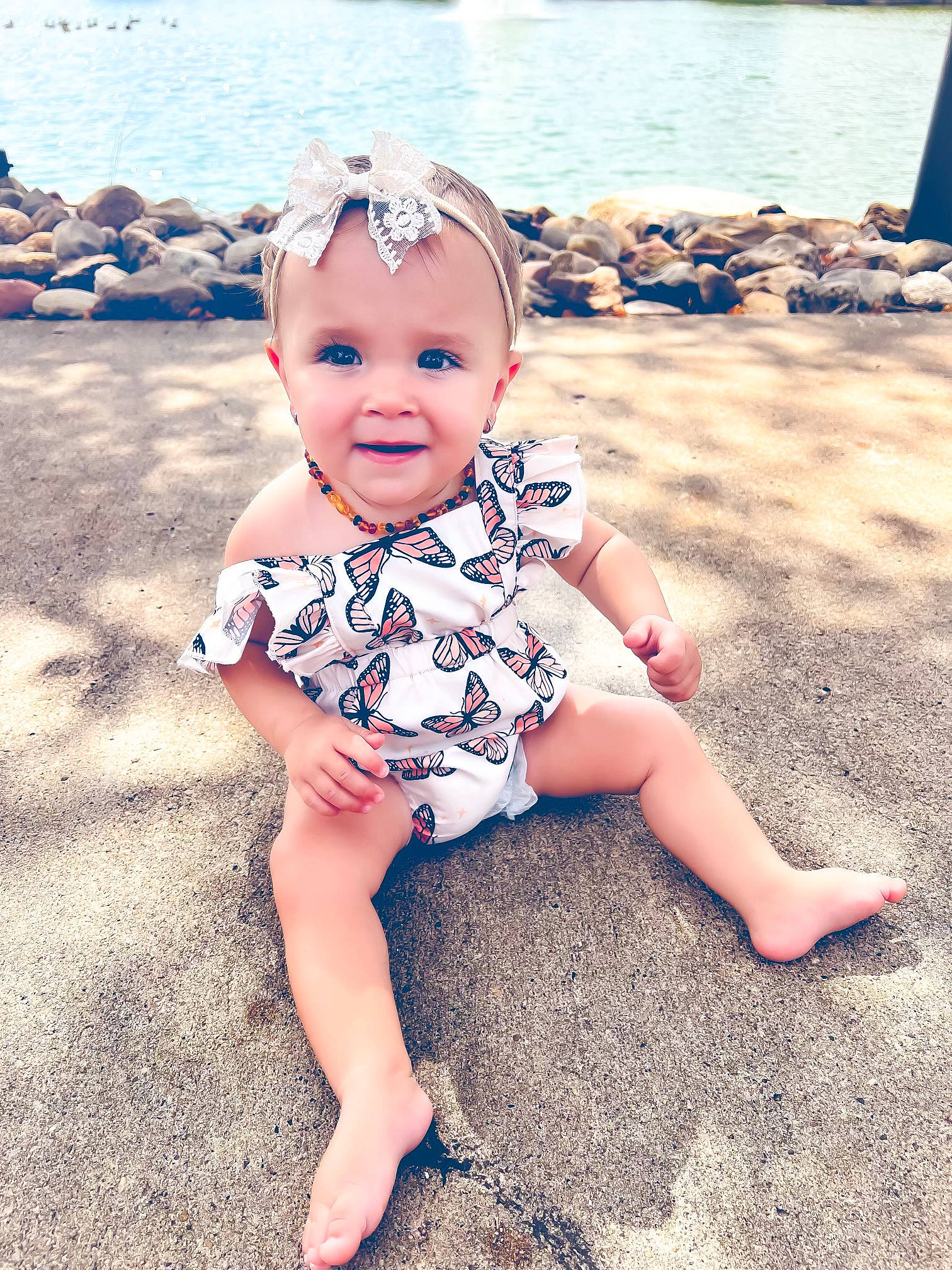 Amia joined the competition — help win amazing prizes! baby, baby_toddler_clothing, beach, child, cool, foot, fun, grass, happy, hat, human_leg, joy, leisure, ocean, pattern, people_in_nature, people_on_beach, person, sitting, smile