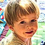 child, toddler, face, smile, hair, outdoor, blanket, toy, playtime, young_child, curious, light, daylight, expression, clothing, cute, messy_face, happy, boy, portrait