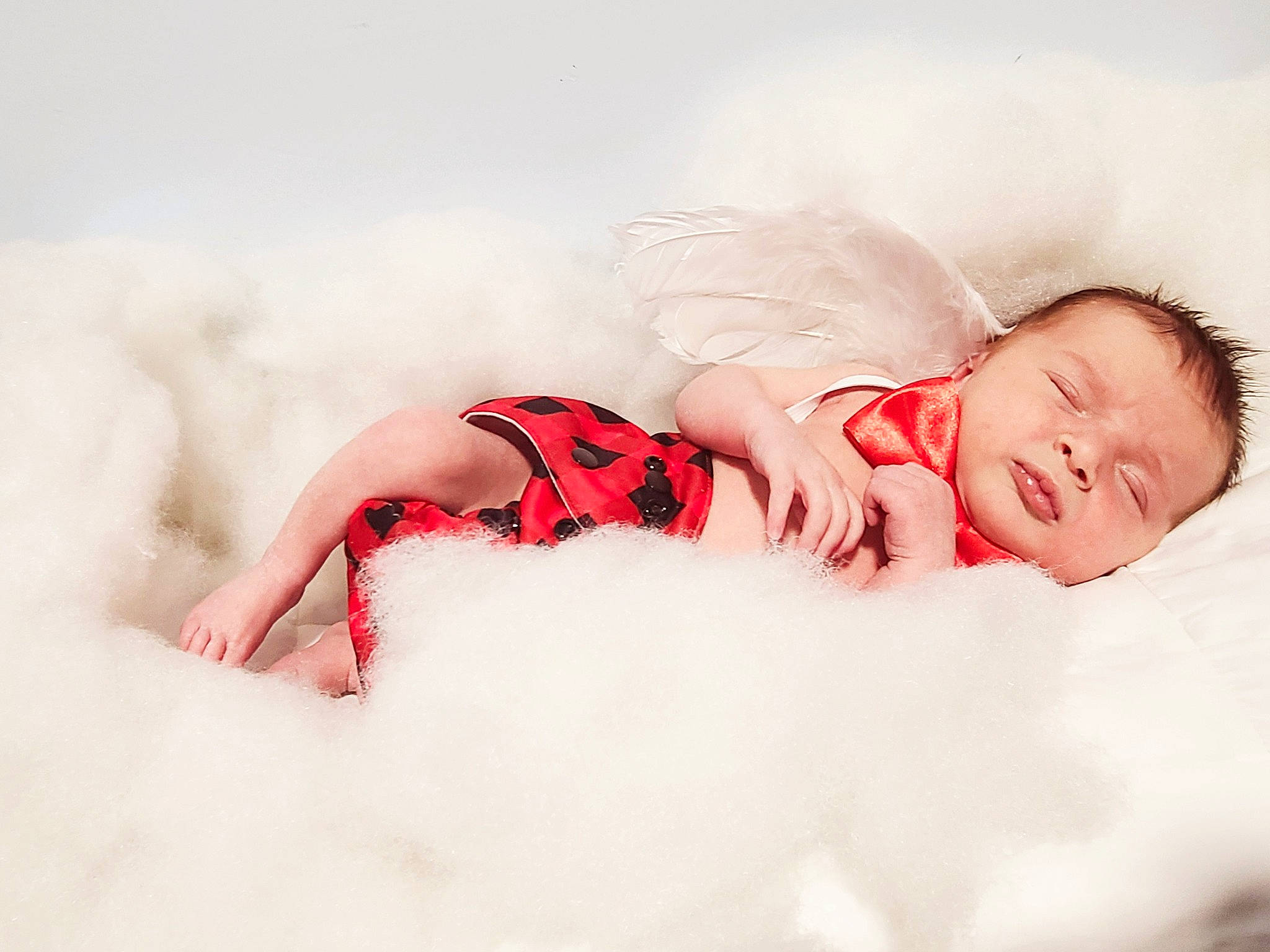Jaxsen is registered to the contest to win money with this photo: baby, baby_sleeping, baby_toddler_clothing, carmine, comfort, dress, flash_photography, flesh, fur, happy, human_body, human_leg, knee, linens, pattern, person, portrait_photography, sitting, sleeve, thigh