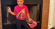 Eliana joined the competition — help win amazing prizes! black_dog, bright_colors, casual_clothing, child, decor, dog, fireplace, girl, happy, home, indoor, peace_sign, person, pet, pink_purse, pink_shoes, playful, smile, standing, tile_floor