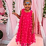 Eliana is registered to the contest to win money with this photo: butterfly, celebration, child, curtain, decoration, dress, face_paint, flower, footwear, girl, happy, indoor, pink, portrait, posing, sandals, smile, stage, tiara, young