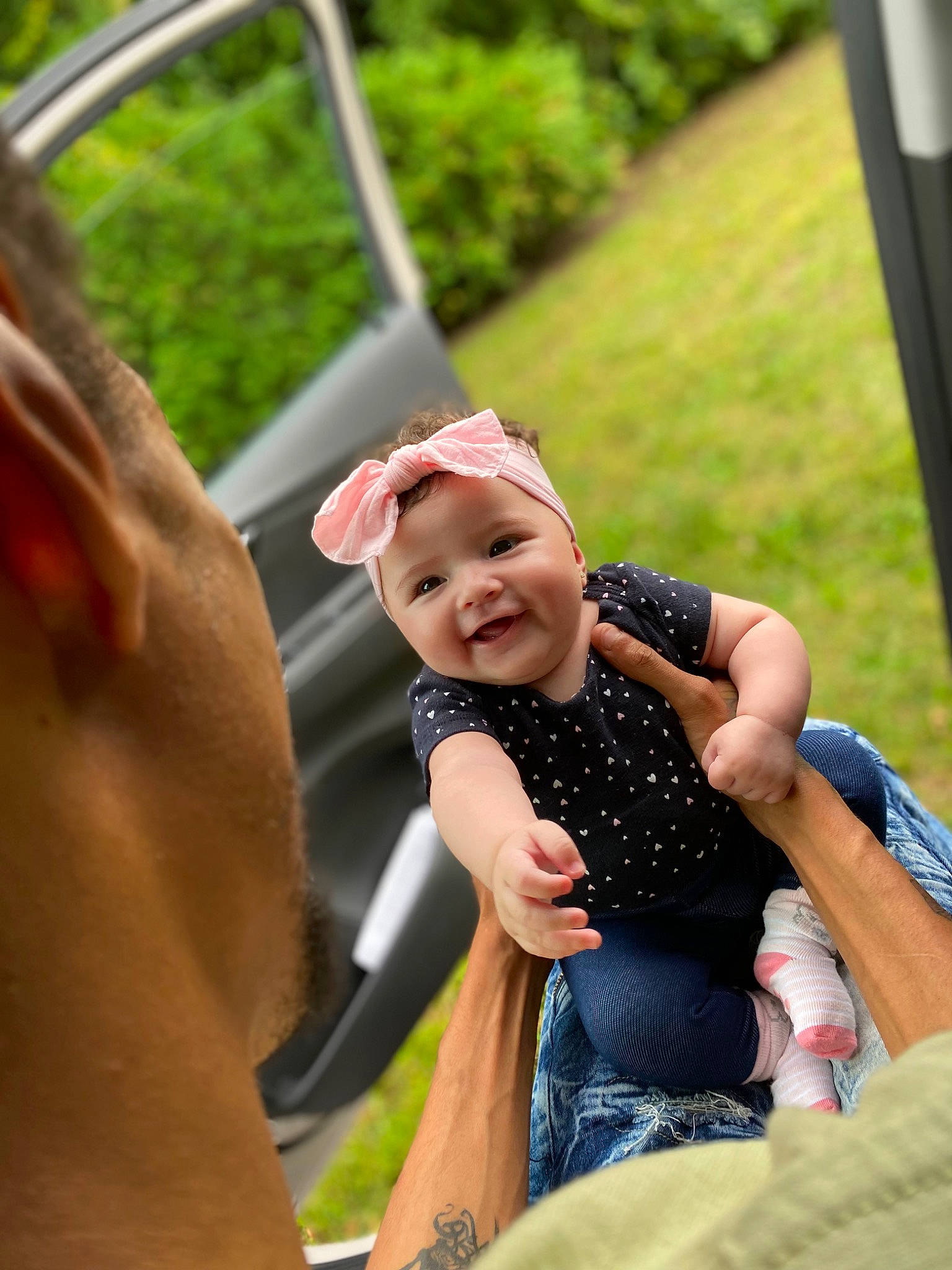 Kehlani joined the competition — help win amazing prizes! arm, baby, child, event, finger, fun, gesture, grass, happy, headwear, joy, leisure, mammal, outdoor_play_equipment, people, person, plant, recreation, smile, summer