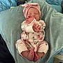 Athena Raven is registered to the contest to win money with this photo: baby, newborn, infant, child, sleeping, cute, floral_clothing, head_wrap, pink, feet, hands, cushion, blanket, soft, indoors, person, portrait, relaxing, sleep, comfort