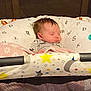 Luna is registered to the contest to win money with this photo: baby, sleeping, crib, blanket, stars, moon, bedding, alphabet, infant, child, cozy, soft, peaceful, indoors, person, cute, rest, young, nursery, portrait