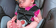 Luna is registered to the contest to win money with this photo: baby, car_seat, sleeping, child, infant, pink_clothing, digital_filter, bear_ears, glasses_filter, straps, foot, hand, blanket, warning_label, head_support, close_up, indoors, cute, peaceful, resting