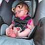 baby, car_seat, sleeping, child, infant, pink_clothing, digital_filter, bear_ears, glasses_filter, straps, foot, hand, blanket, warning_label, head_support, close_up, indoors, cute, peaceful, resting