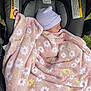 newborn, baby, blanket, pink, floral, hat, car_seat, sleeping, child, infant, cozy, striped, warning_label, fabric, outdoor, resting, head, wrapped, soft, person