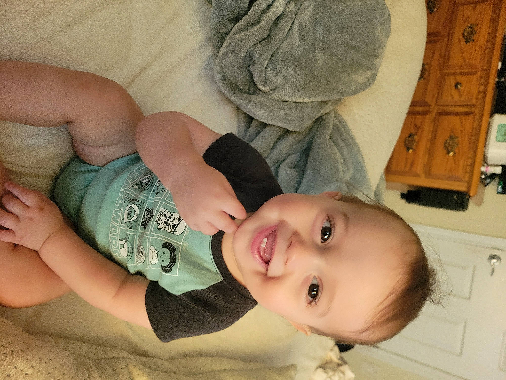 Grayson is registered to the contest to win money with this photo: baby, cabinetry, cheek, comfort, drawer, eye, eyelash, face, gesture, hair, happy, head, human_body, joy, leg, lip, mouth, neck, nose, person