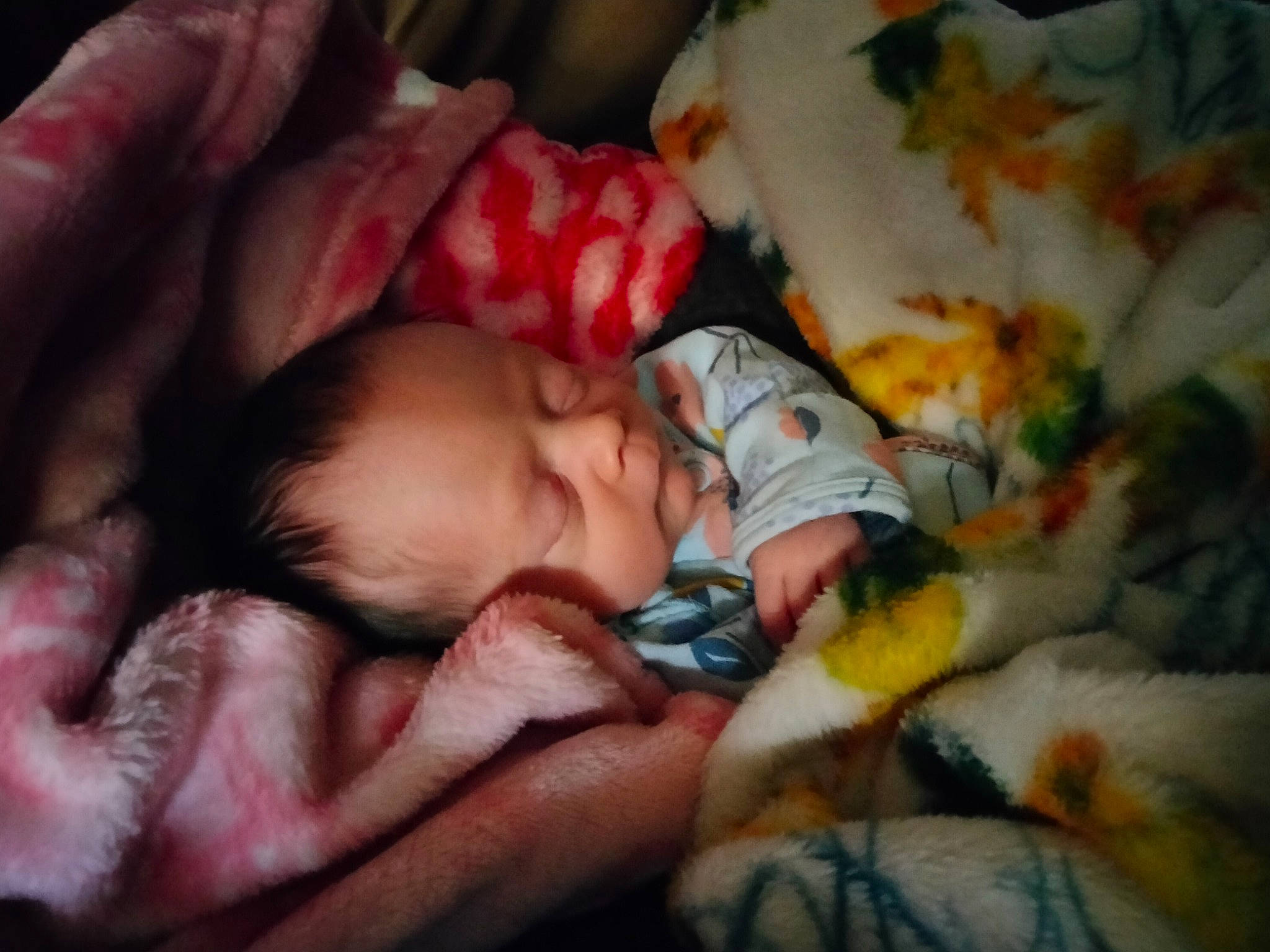 Emberlee is registered to the contest to win money with this photo: baby, baby_toddler_clothing, bedtime, cheek, comfort, eye, face, fur, hand, head, human_body, iris, linens, mouth, nail, nap, nose, person, skin, textile