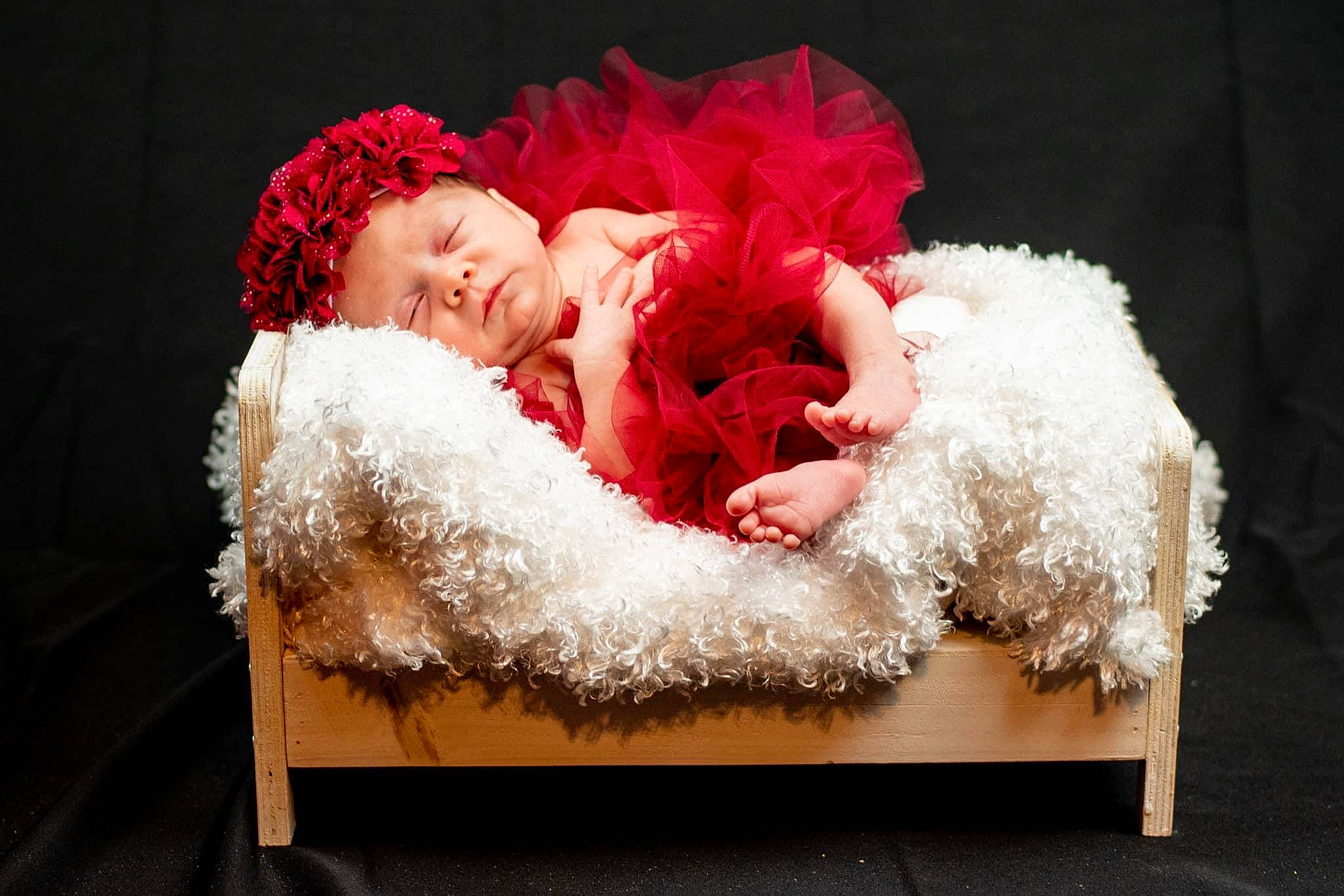 Emberlee is registered to the contest to win money with this photo: baby, carmine, comfort, costume_hat, embellishment, event, fashion_accessory, fur, fur_clothing, magenta, natural_material, peach, person, petal, room, sitting, still_life_photography, toddler, winter