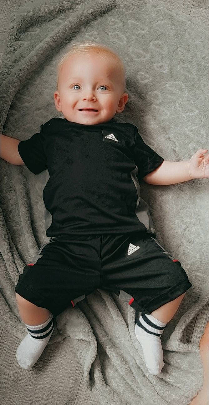 Corey And Caiden is registered to the contest to win money with this photo: arm, cheek, chin, comfort, eye, face, facial_expression, hairstyle, head, joint, joy, leg, muscle, organ, person, shoulder, skin, sleeve, smile, standing