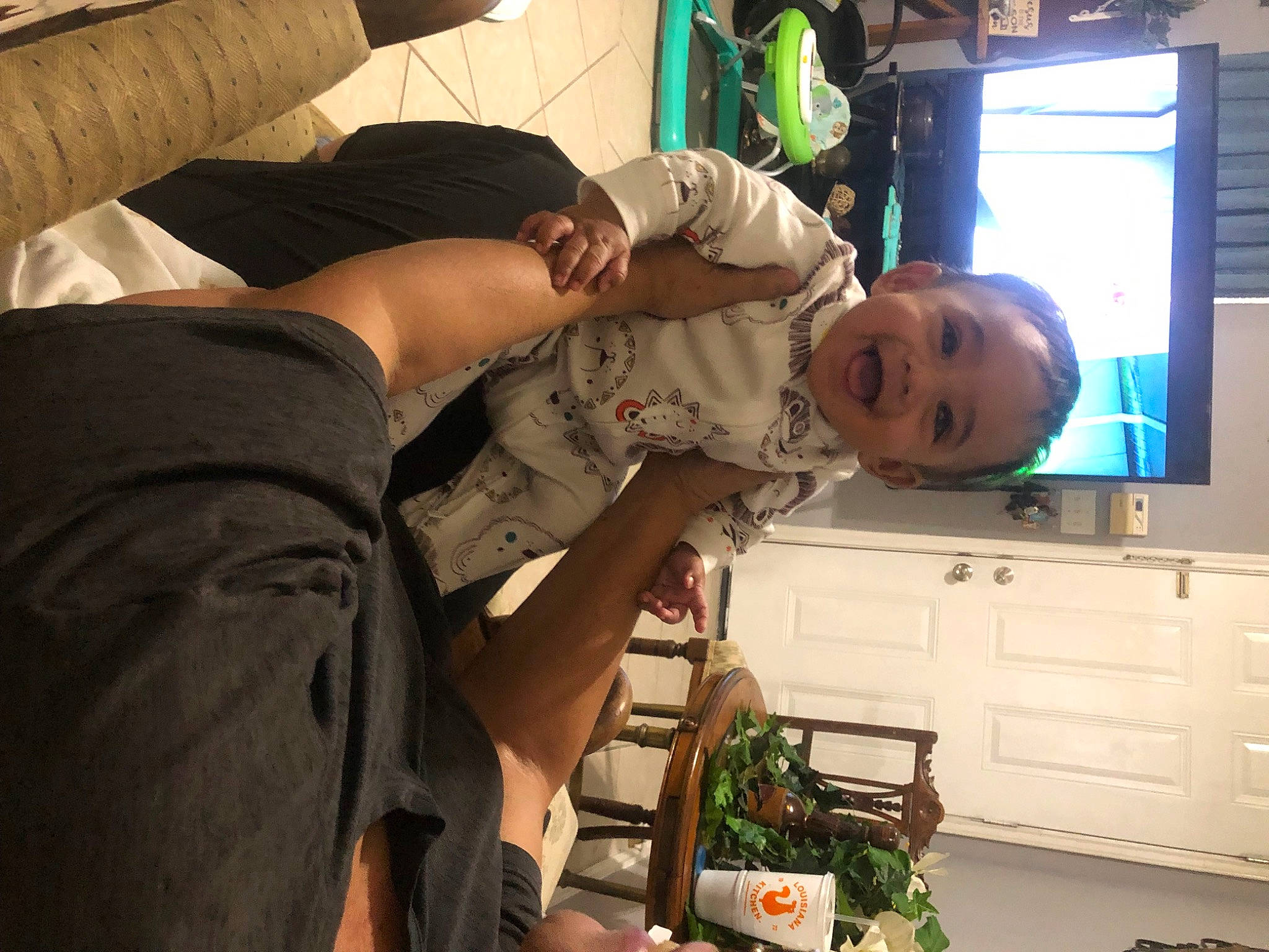 Aiden joined the competition — help win amazing prizes! baby, bookcase, cabinetry, chest_of_drawers, child, comfort, cupboard, drawer, elbow, entertainment_center, event, fun, hat, houseplant, joy, person, room, shelf, smile, television