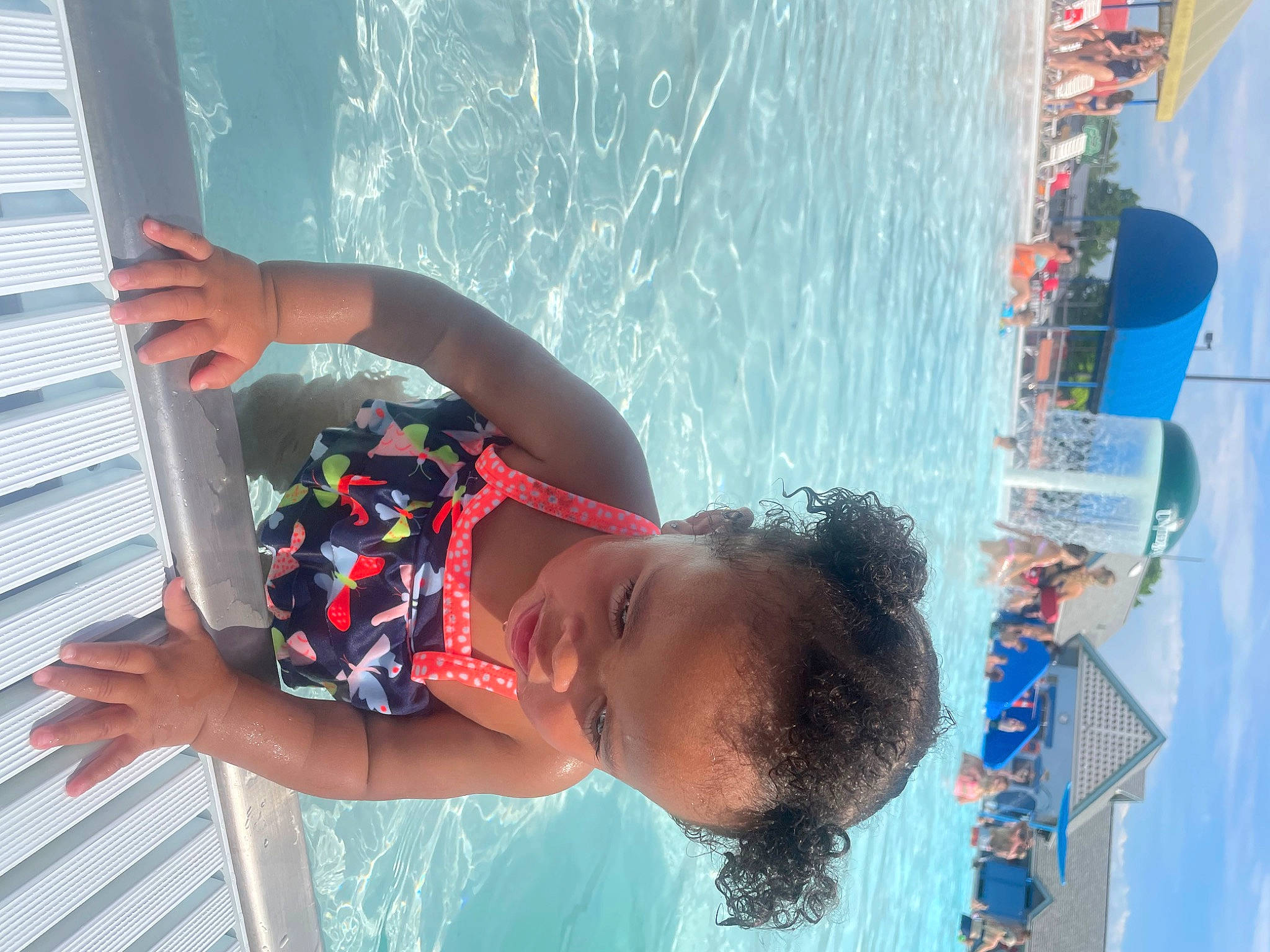 Akeelah is registered to the contest to win money with this photo: azure, baby, bathing, beach, blue, child, elbow, fun, happy, lake, leisure, person, photograph, recreation, red, sky, summer, swimming_pool, toddler, vacation