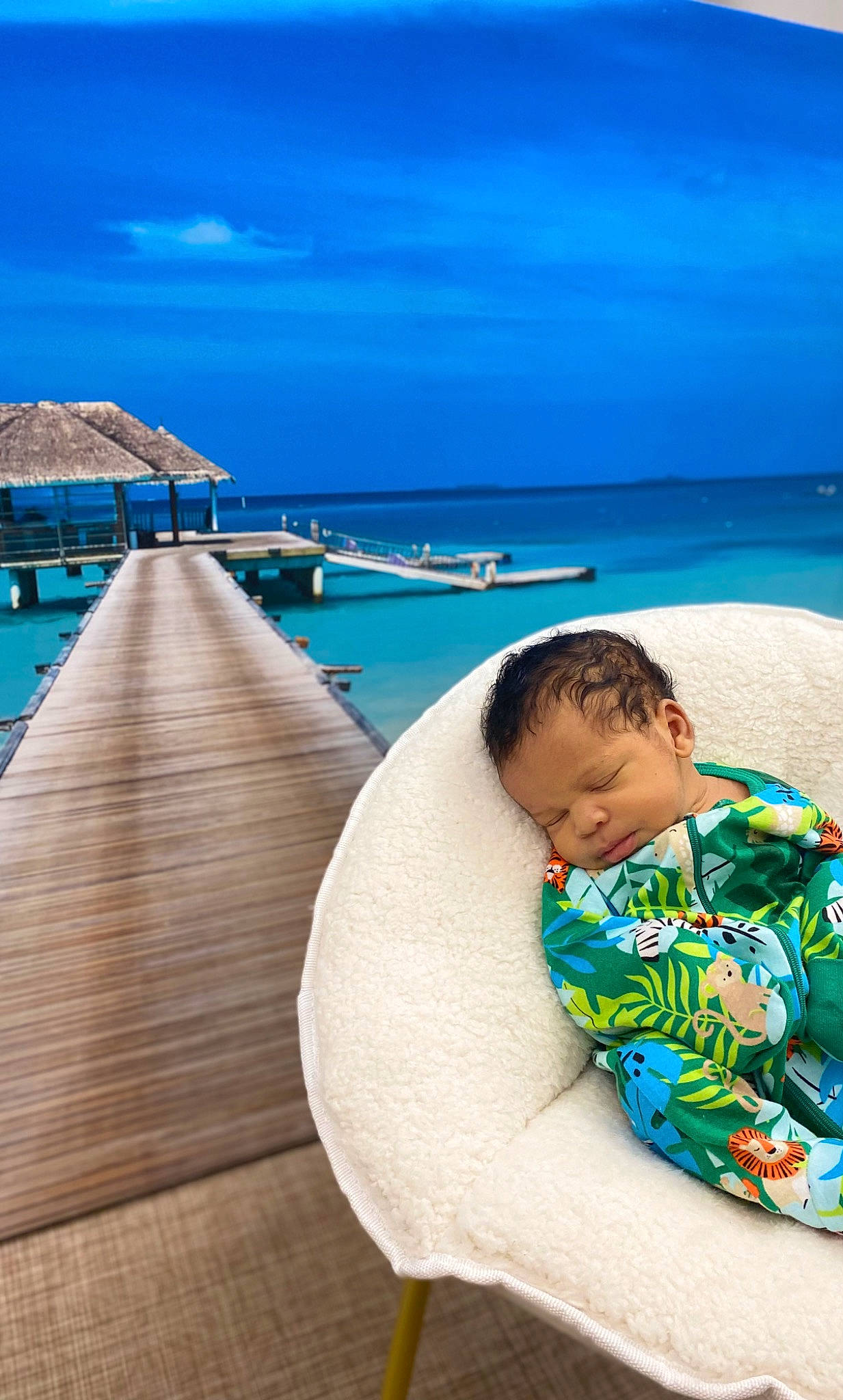 Cadence is registered to the contest to win money with this photo: azure, beach, blue, caribbean, cloud, coastal_and_oceanic_landforms, comfort, happy, horizon, leisure, outdoor_furniture, person, seaside_resort, sky, sunlounger, t_shirt, toddler, travel, tropics, water