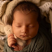 Gabin participe au concours pour gagner de l'argent avec cette photo : newborn, baby, sleeping, swaddled, blanket, basket, knitted_toy, bunny, soft_lighting, closeup, infant, peaceful, cute, hand, face, wrapped, cozy, portrait, toddler, child