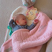 Medinah joined the competition — help win amazing prizes! baby, sleeping, blanket, pink, plush_toy, bear, wooden_sign, 3_months, floor, soft_texture, striped_clothing, child, infant, peaceful, cozy, knitted, cute, lying_down, indoor, resting