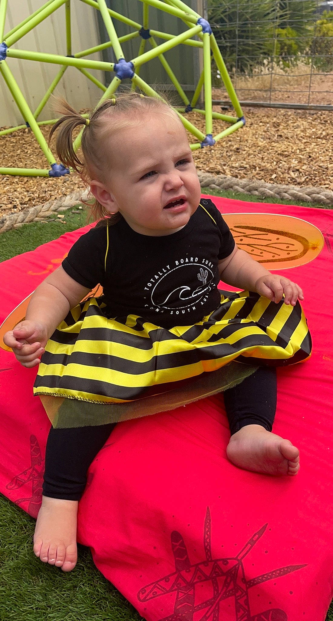 Sahara is registered to the contest to win money with this photo: baby, baby_toddler_clothing, black, child, event, flooring, fun, grass, green, happy, leisure, pattern, person, pink, plant, playground, recreation, skin, sorrow, summer