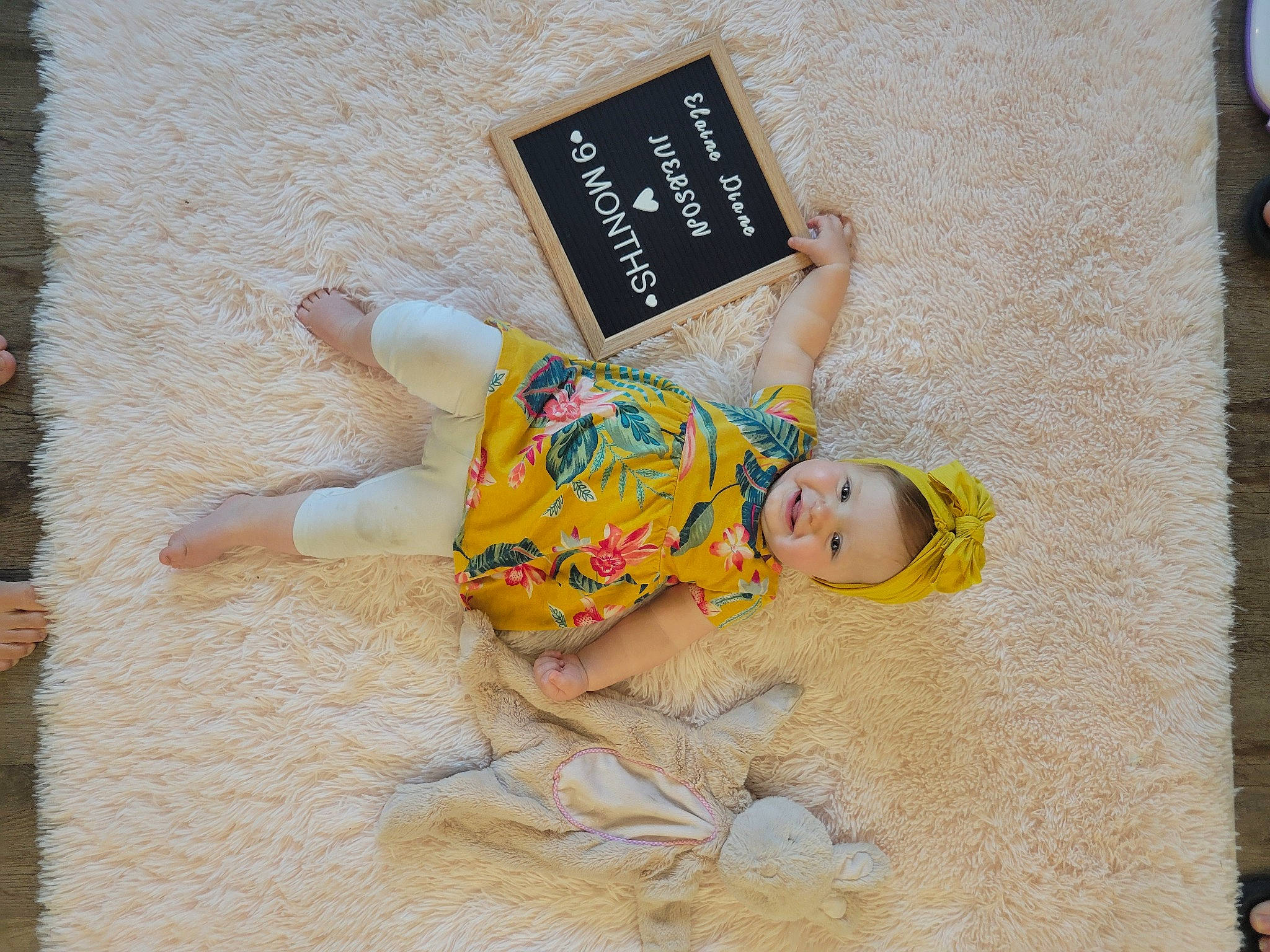 Elaine is registered to the contest to win money with this photo: art, baby, baby_toddler_clothing, child, craft, fawn, flooring, font, happy, paper_product, pattern, person, rectangle, room, textile, toddler, toy, visual_arts, wood, wrist