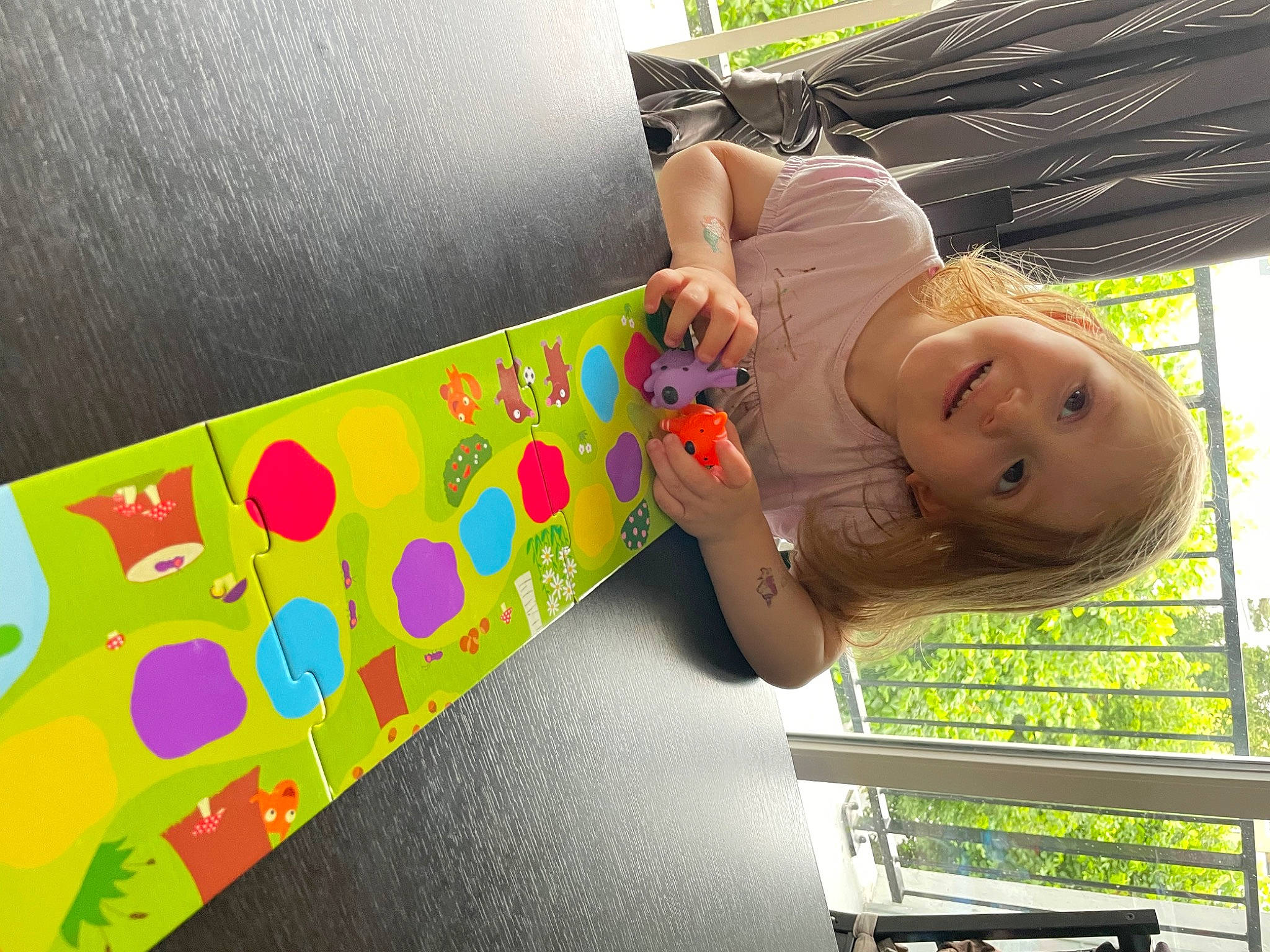 Chloé participe au concours pour gagner de l'argent avec cette photo : baby, baby_toddler_clothing, child, comfort, facial_expression, font, fun, grass, happy, joy, leisure, magenta, paper_product, pattern, person, pink, play, room, smile, toddler