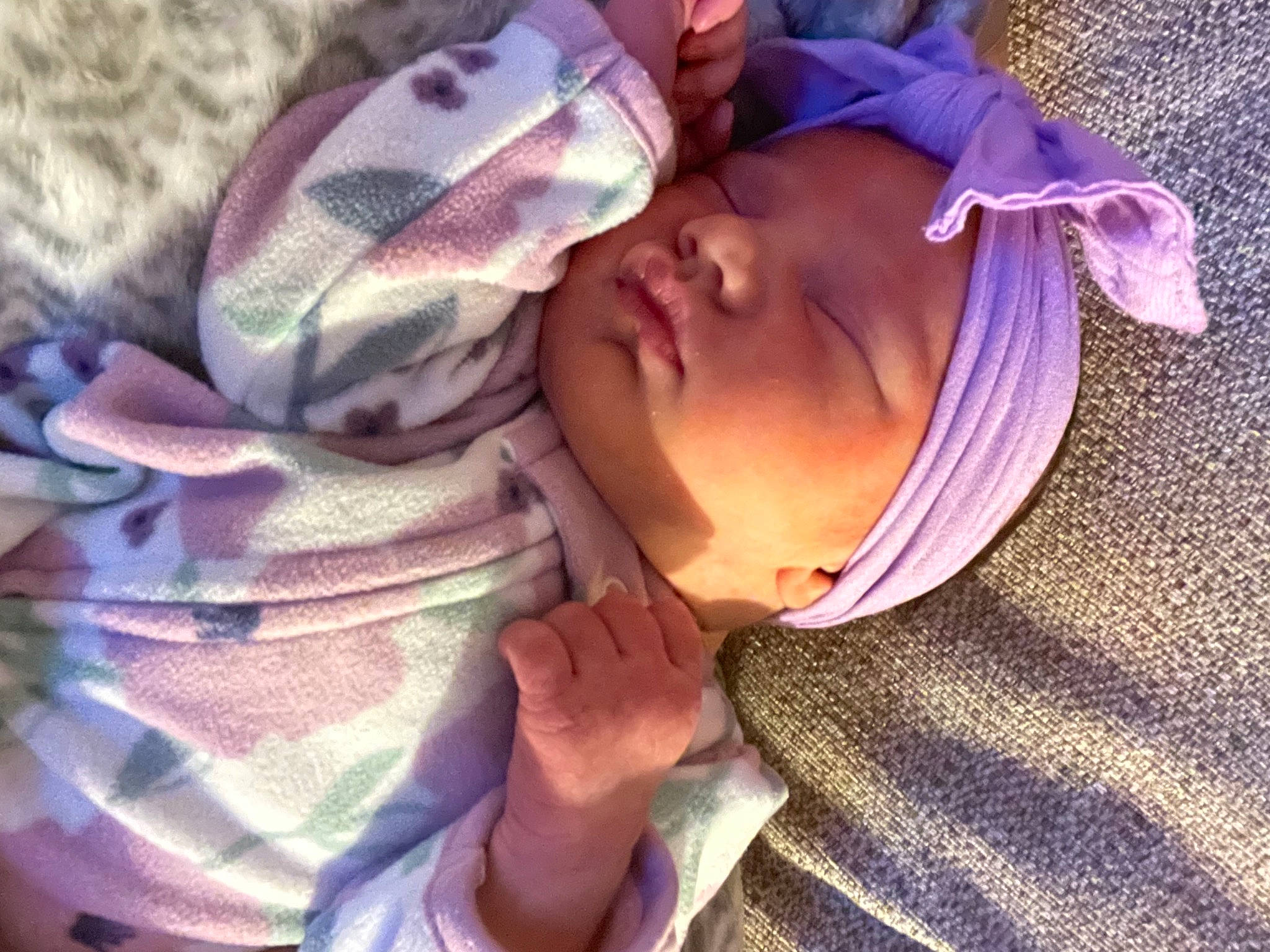 Kinsley is registered to the contest to win money with this photo: baby, baby_toddler_clothing, bedtime, cheek, child, comfort, finger, gesture, happy, hat, headwear, linens, nose, person, pink, plant, purple, smile, thumb, toddler