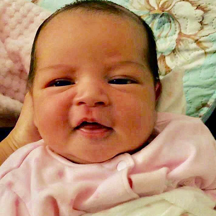 Juliette is registered to the contest to win money with this photo: baby, baby_making_funny_faces, cheek, child, face, facial_expression, head, lip, mouth, nose, person, pink, skin, smile, toddler