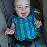 Walker is registered to the contest to win money with this photo: baby, child, infant, smiling, happy, portrait, car_seat, harness, safety_belt, striped_clothing, blue, green, bright_eyes, open_mouth, hands, indoor, seated, close_up, photography, joyful