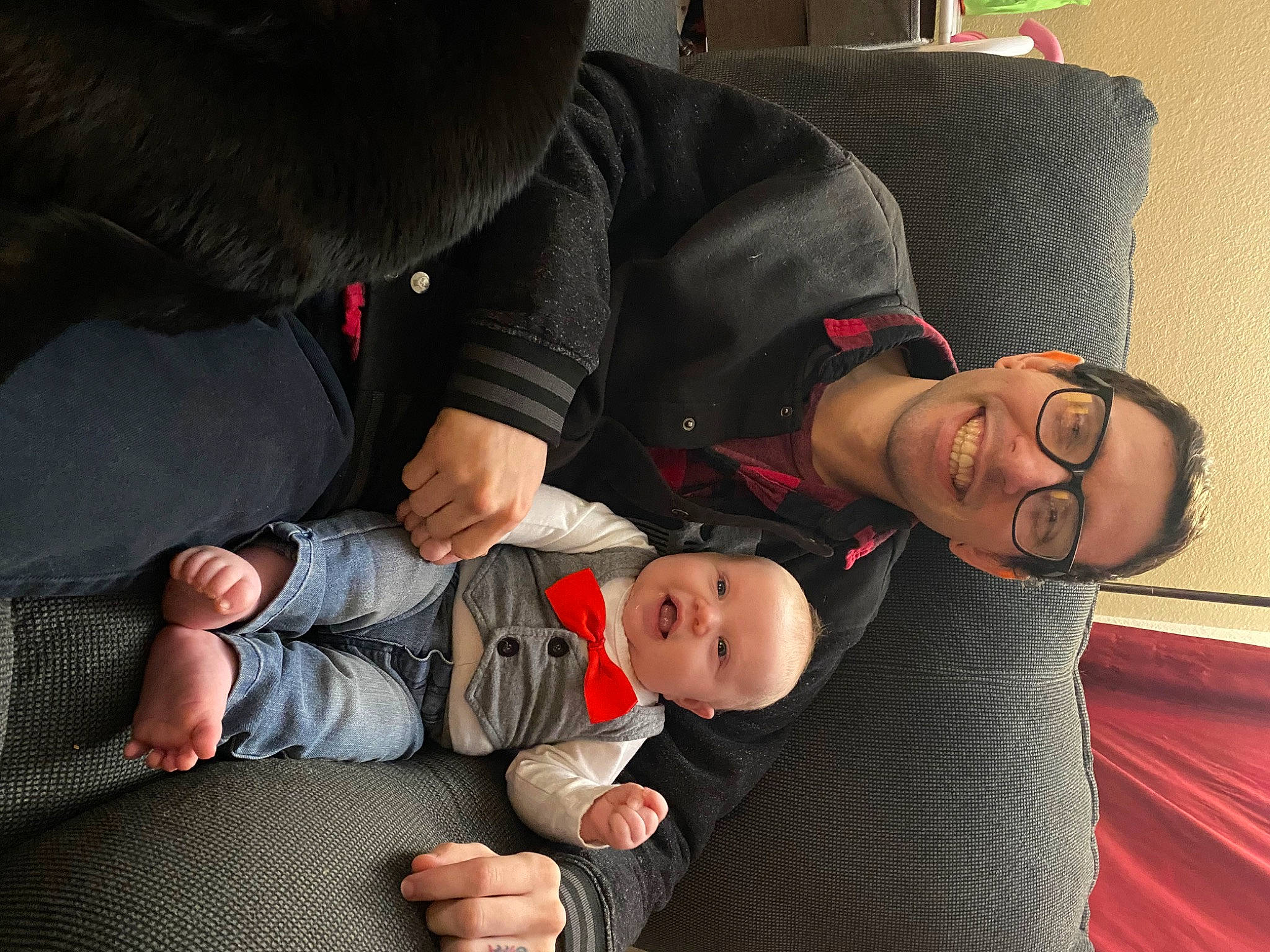 Eden is registered to the contest to win money with this photo: baby, baby_toddler_clothing, child, comfort, couch, event, finger, fun, gesture, hand, happy, interaction, joint, joy, lap, mouth, person, sitting, smile, thumb