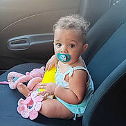 Ayanna joined the competition — help win amazing prizes! baby, car, car_interior, clothing, cream, cushion, dessert, face, food, head, homedecor, icecream, person, photography, portrait, sitting, summer, swimwear, transportation, vehicle