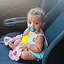 baby, car, car_interior, clothing, cream, cushion, dessert, face, food, head, homedecor, icecream, person, photography, portrait, sitting, summer, swimwear, transportation, vehicle