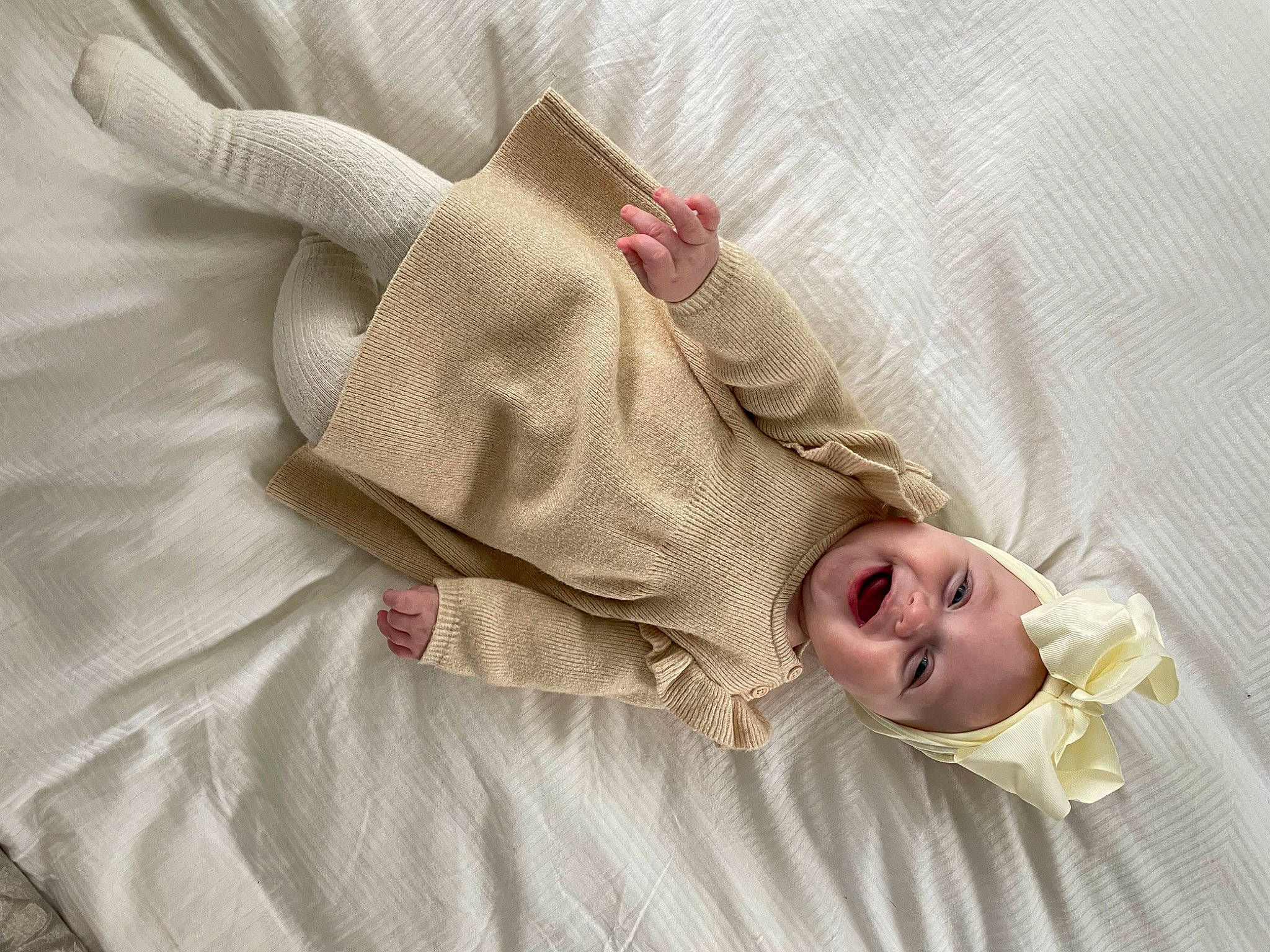 Bella joined the competition — help win amazing prizes! baby, baby_products, baby_safety, baby_sleeping, baby_toddler_clothing, bed, bed_sheet, bedding, beige, comfort, dress, eye, fashion_accessory, hand, headgear, headwear, linens, pattern, person, sleeve