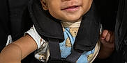 Bryson joined the competition — help win amazing prizes! baby, child, smile, stroller, seatbelt, happy, infant, hand, face, clothing, blue, black, cute, person, portrait, sitting, young, babywear, straps, comfort
